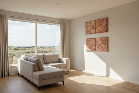 Modern living room with a white sofa, large windows, and FeltArt 'Naturale' in the color terra bloom, 60x60.